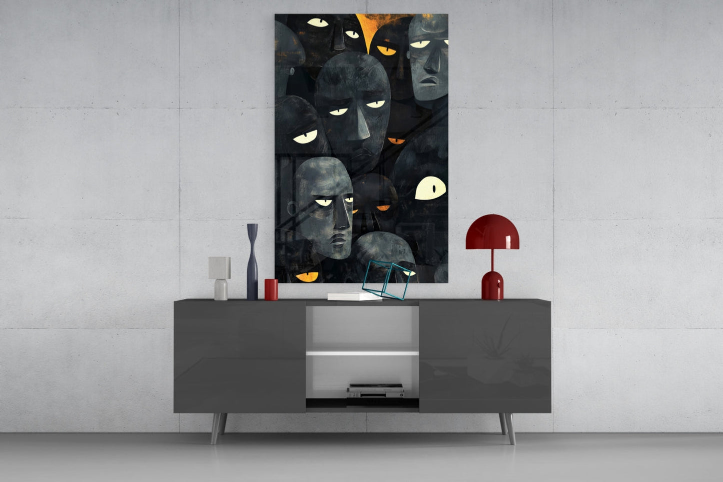 Dark glass wall art featuring stylized faces with glowing eyes displayed above a gray media console in a modern interior setting.