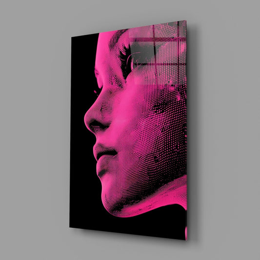 Angled perspective view of pink and black halftone portrait glass wall art displaying a woman's profile against gray background.