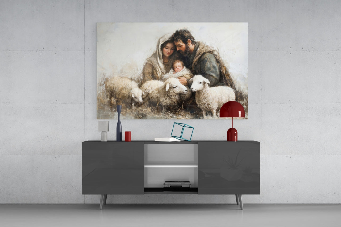 Glass wall art depicting a bearded man, woman, and infant surrounded by white lambs, displayed above a dark media console.