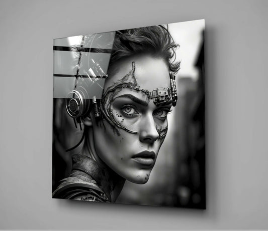 Black and white glass wall art depicting a cyborg woman in profile with mechanical headgear and facial augmentations, mounted on gray wall.