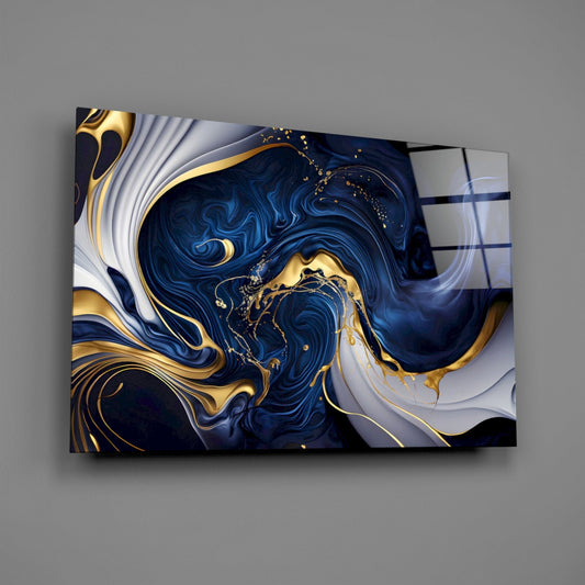 Angled front view of a glass wall art panel displaying swirling navy blue and white patterns with gold accents, mounted on gray wall.