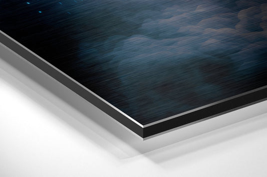Close-up angled view of layered Dibond panel edges showing brushed dark blue surface with gray and white backing layers.