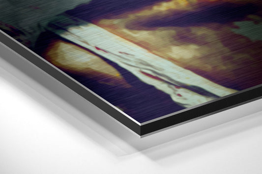 Close-up angled view of layered aluminum dibond print showing teal, green, and blonde brushed tones with blurred painterly effect.