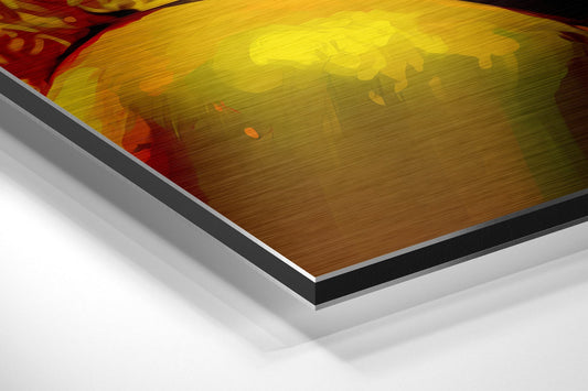 Close-up angled view of layered Dibond panel edges showing yellow and gold brushed aluminum surface with red accent and black border trim.