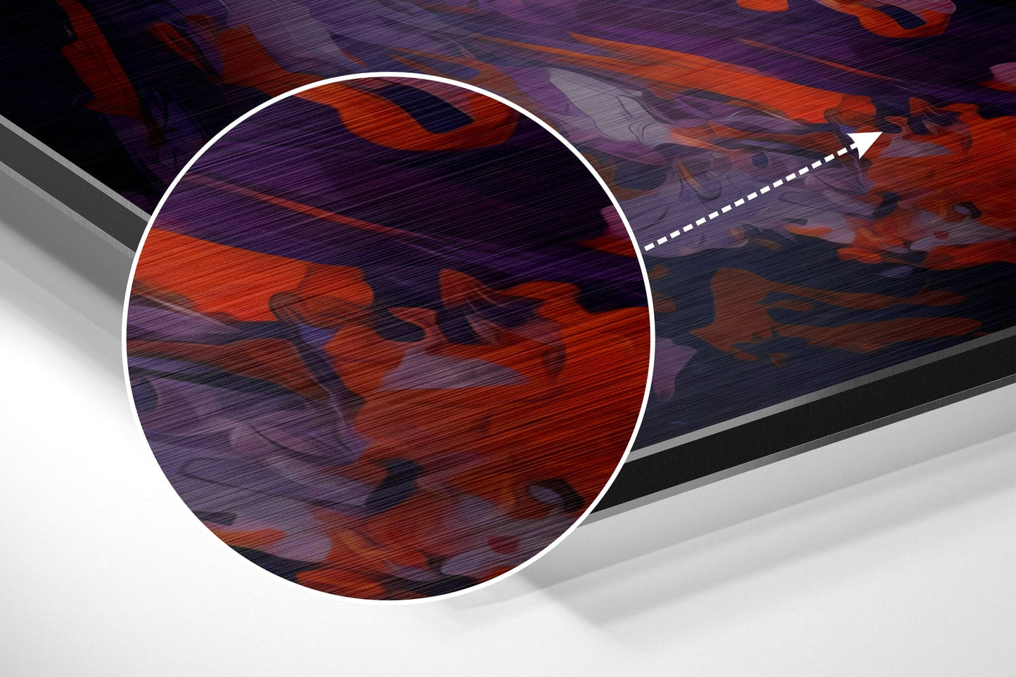 Magnified detail of brushed aluminum wall art showing red and purple abstract brushstrokes with textured surface.
