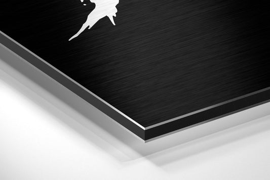 Angled perspective view of layered black brushed aluminum and white composite board showing product depth and material construction.