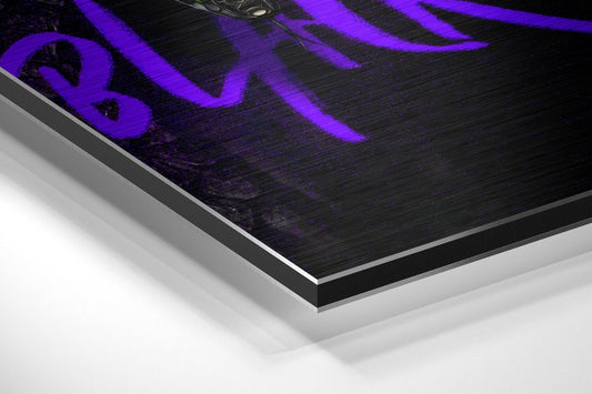 Close-up angled view of brushed aluminum dibond panel with purple neon graffiti coiled snake design on black surface.