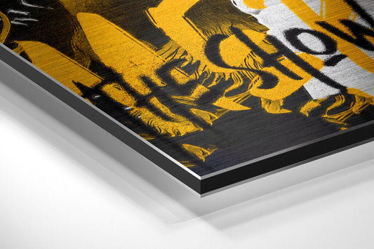 Close-up angled view of brushed aluminum Dibond wall art showing yellow and black painted rock singer design with white accents and layered edge detail.