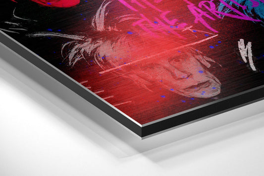 Angled perspective view of brushed aluminum dibond panel displaying neon red and magenta abstract artwork with blue accents.
