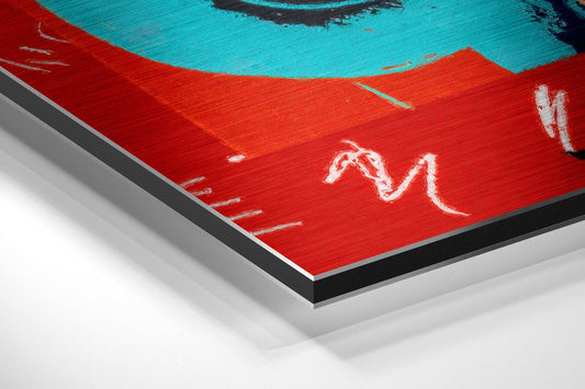 Angled perspective view of red brushed aluminum dibond panel with turquoise dollar sign and white markings, showing layered edge construction.