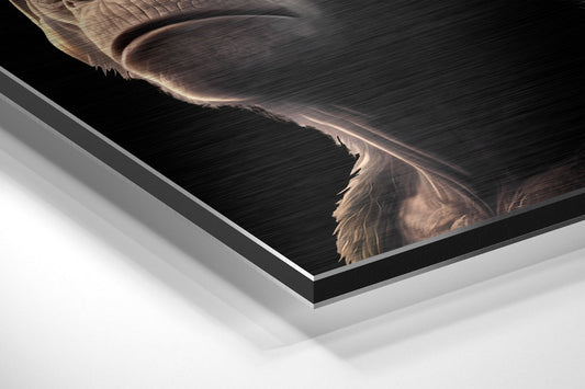 Close-up angled view of brushed aluminum dibond wall art showing layered edge construction and metallic finish detail.