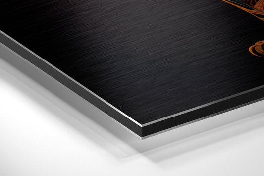 Close-up angled view of layered Dibond panel edges showing black brushed aluminum surface with white and gray backing layers.