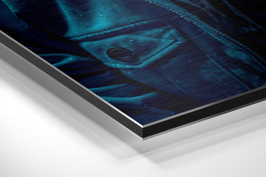Angled edge-on view of brushed aluminum wall art showing layered construction with teal gorilla design on dark background.