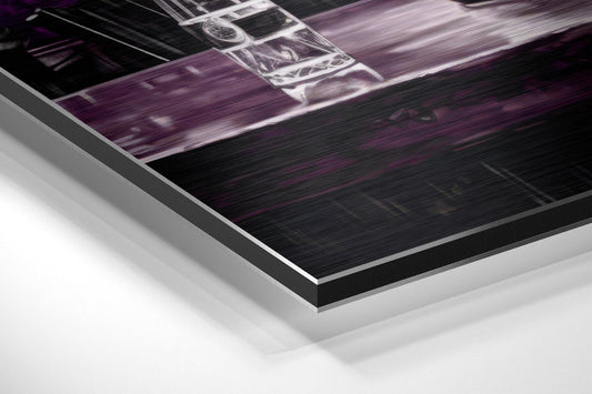 Close-up angled view of brushed aluminum Dibond wall art with purple and black tones showing layered edge construction.