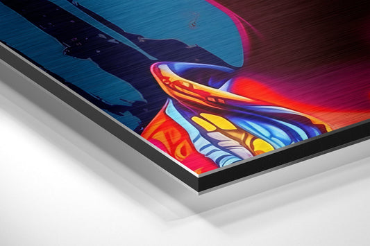 Angled perspective view of vibrant neon pop art print on brushed aluminum dibond showing colorful woman with lollipop against blue and magenta background.