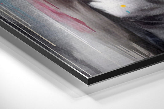 Close-up angled view of brushed aluminum dibond print edge showing black border frame and layered mounting structure against white background.