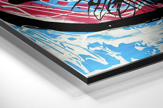 Close-up angled view of layered Dibond wall art showing blue and white abstract design with black drip lines and pink striping, mounted on black backing.