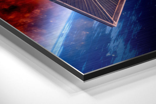 Angled view of brushed aluminum Dibond wall art showing red and blue gradient with solar panel design and metallic layered edge detail.