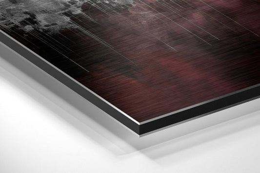 Close-up angled view of layered burgundy and black brushed aluminum dibond panel with white backing, showing edge detail and surface texture.