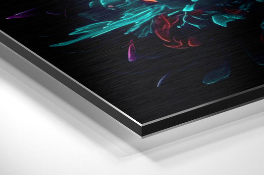Angled side view of layered aluminum dibond print showing brushed metal edges and neon cyan, purple, and red abstract brushstroke artwork on black surface.