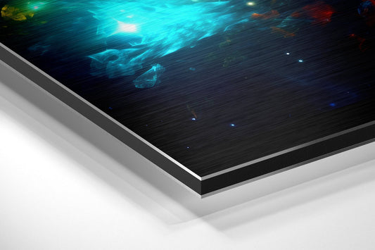 Angled perspective view of brushed aluminum Dibond wall art with turquoise nebula clouds and glowing lights against dark background.