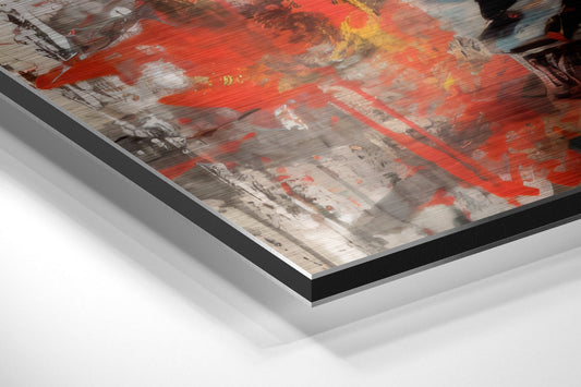 Close-up angled view of layered brushed aluminum and black frame edges of red splatter boxer wall art.
