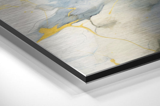 Close-up angled view of navy blue and gold marble design on brushed aluminum Dibond panel with black beveled edge.