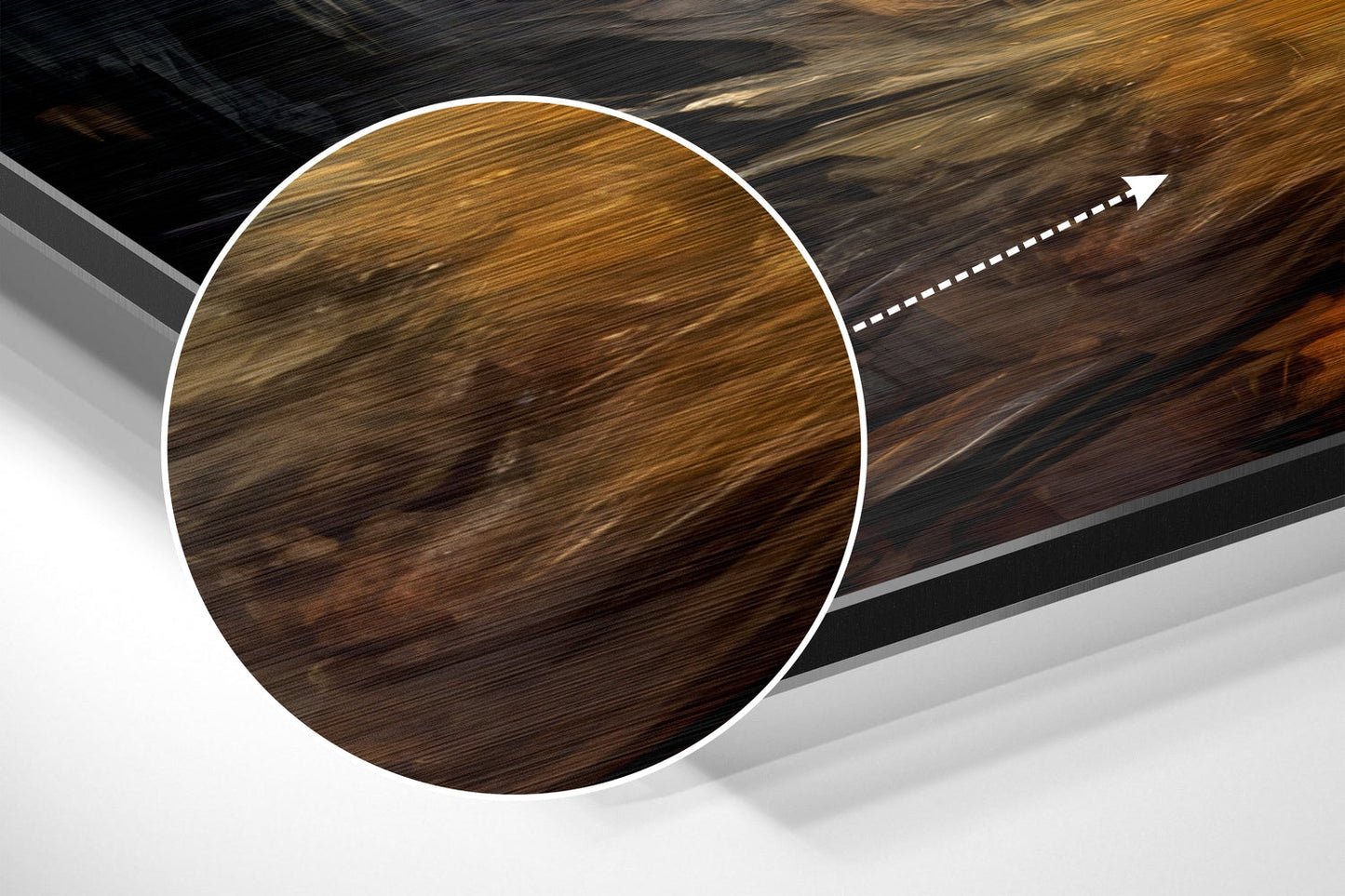 Close-up angled view of dark wood-grain circular sample with white border against layered brushed aluminum and gray background with directional arrow.