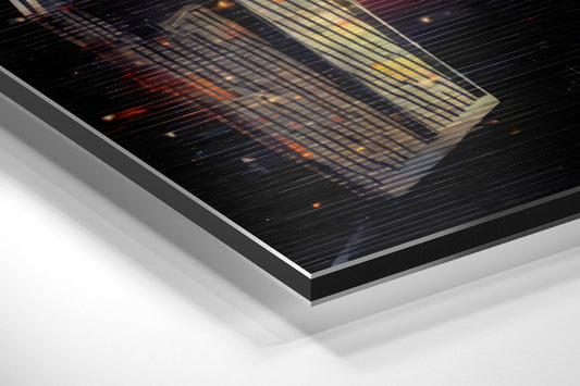 Angled product shot of brushed aluminum Dibond wall art with orange and yellow glowing starfighter against dark space background.