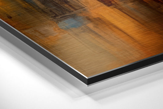 Close-up angled view of layered Dibond wall art showing wood grain surface with black and silver edge trim against white background.