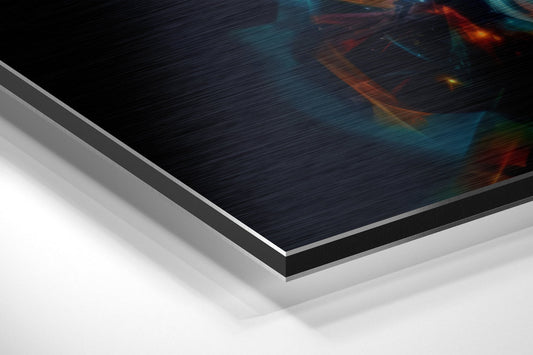 Close-up angled view of brushed aluminum Dibond panel edges showing layered material construction with dark textured surface and colorful abstract design visible.