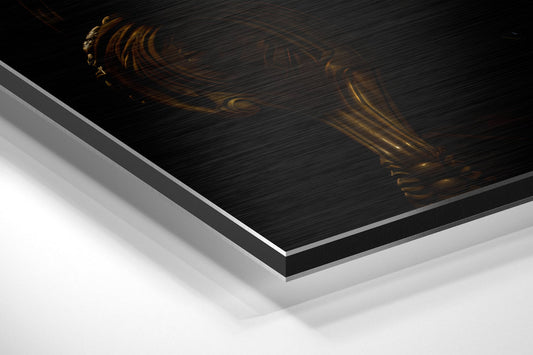 Angled perspective view of layered aluminum dibond print showing black brushed metal surface with gold lion and champagne glass imagery.