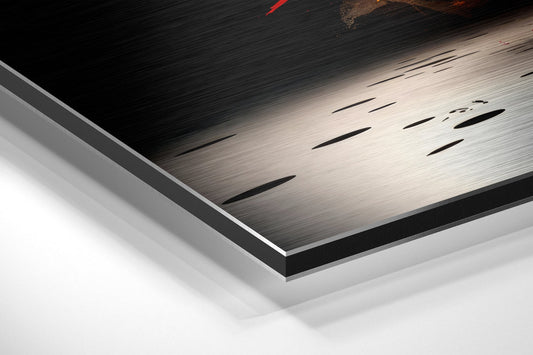Close-up angled view of layered aluminum dibond panel showing brushed metal surface with black slots and white backing layer.