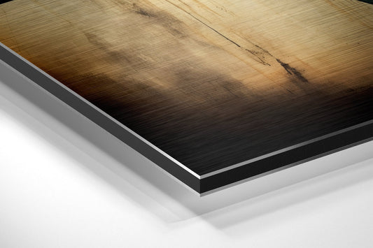 Close-up angled view of layered brushed aluminum and black dibond sheet edges showing material construction and depth.