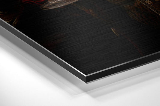 Close-up angled view of layered aluminum dibond panels showing black brushed metal surface with white and gray backing layers.