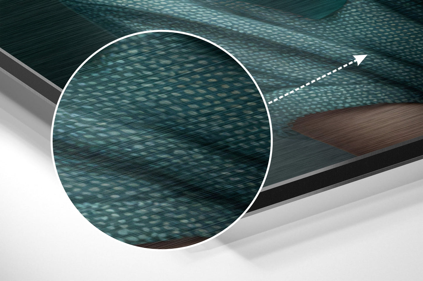Close-up detail of brushed aluminum Dibond wall art showing teal and turquoise textured surface with directional arrow indicator.