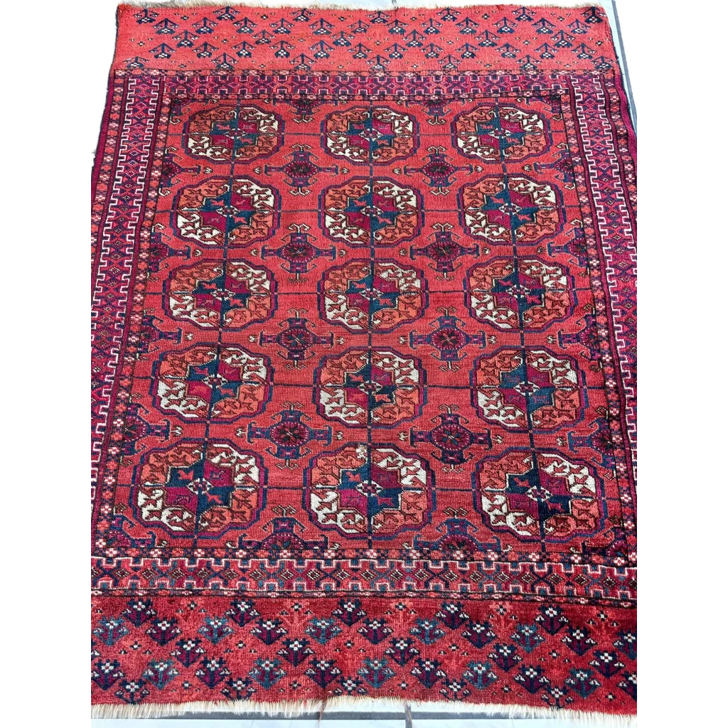 Antique 1920s Tribal Turkoman Tekke Wedding Rug in red geometric floral pattern