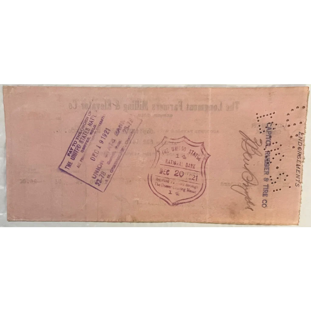 Vintage Longmont Farmers Milling Voucher Check featuring unique stamps and markings