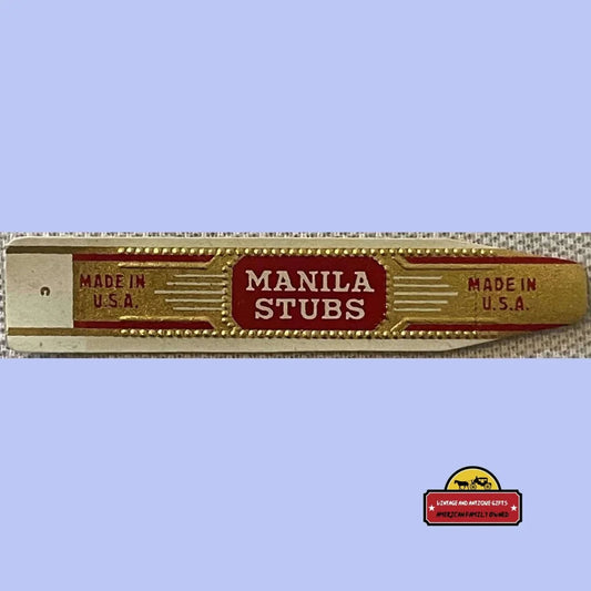 Vintage red and gold cigar band reading "Manila Stubs Made in U.S.A."