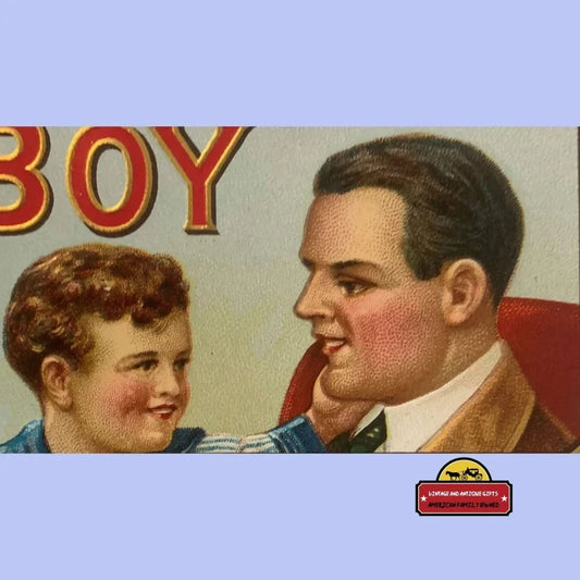 Embossed vintage cigar label showing smiling boy and man, red "BOY" text.