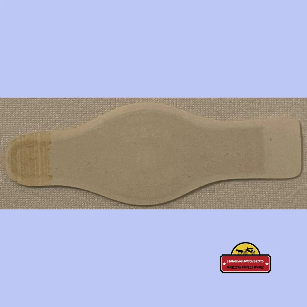 Beige bottle-shaped leather piece for the Rare Antique Uncle Willie Cigar Band