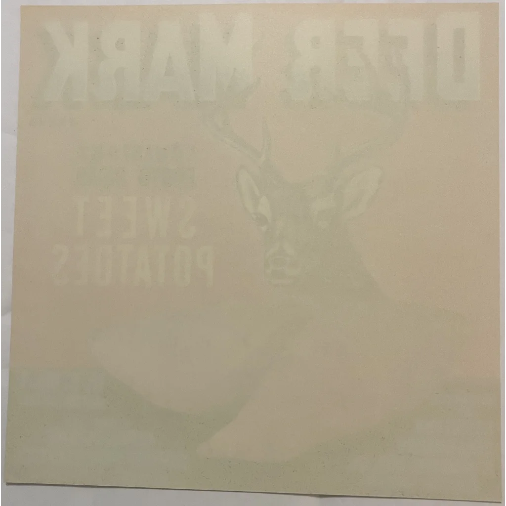 Faint butterfly outline on a pale background of Rare 1950s Deer Mark Crate Label