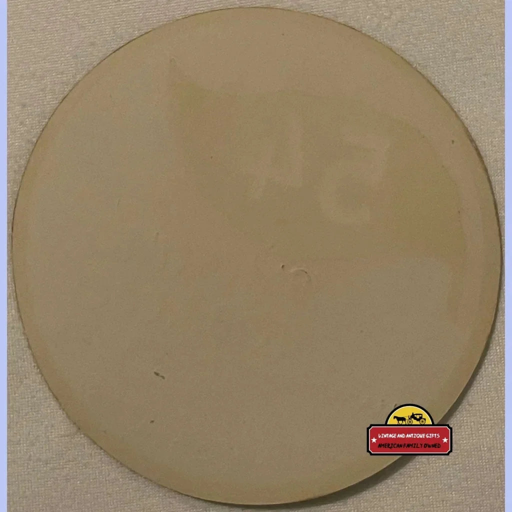 Circular beige disc with smooth surface from a Rare Antique Smoking Tobacco Label, 1910s