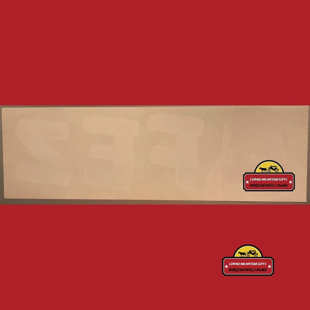 Wooden panel with a small logo, showcasing a Vintage Fez Crate label from the 1960s