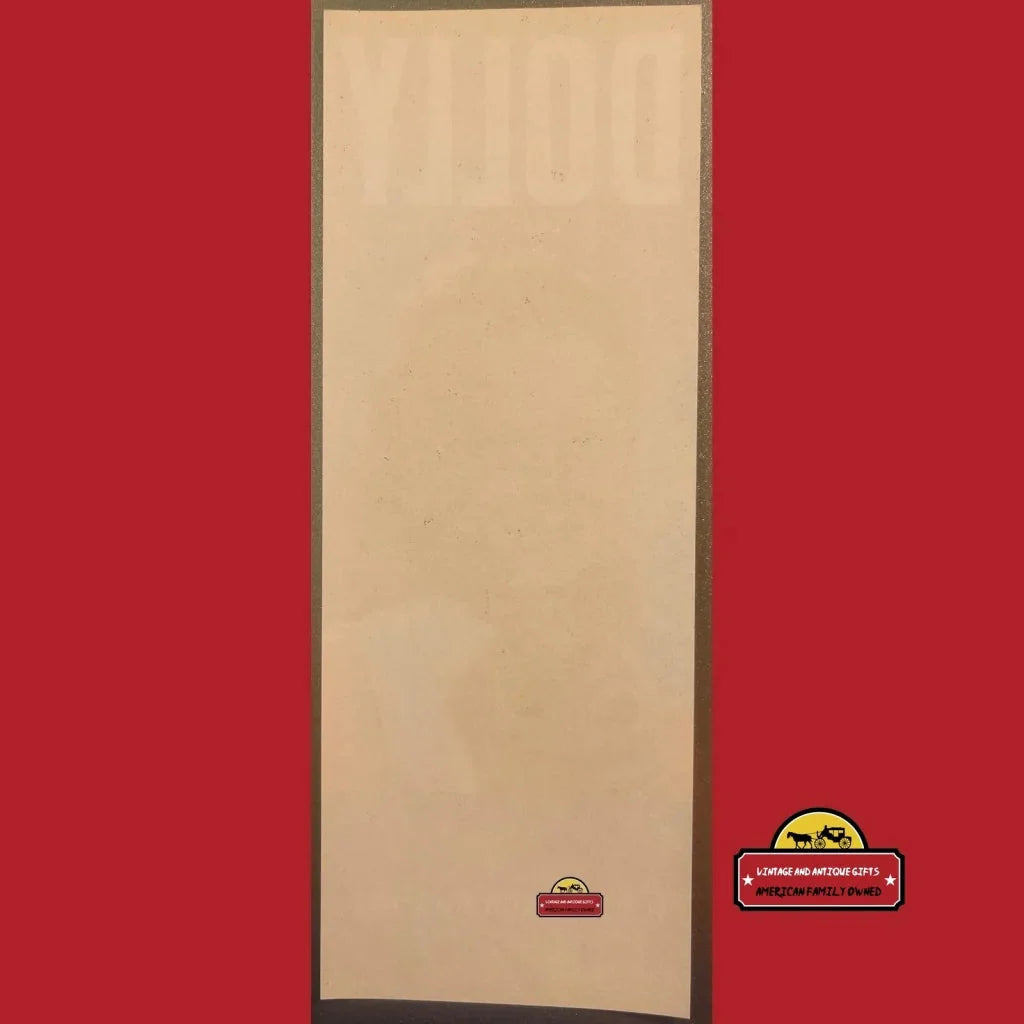 Beige yoga mat with red border next to Rare 1940s Antique Vintage Dolly Crate Label