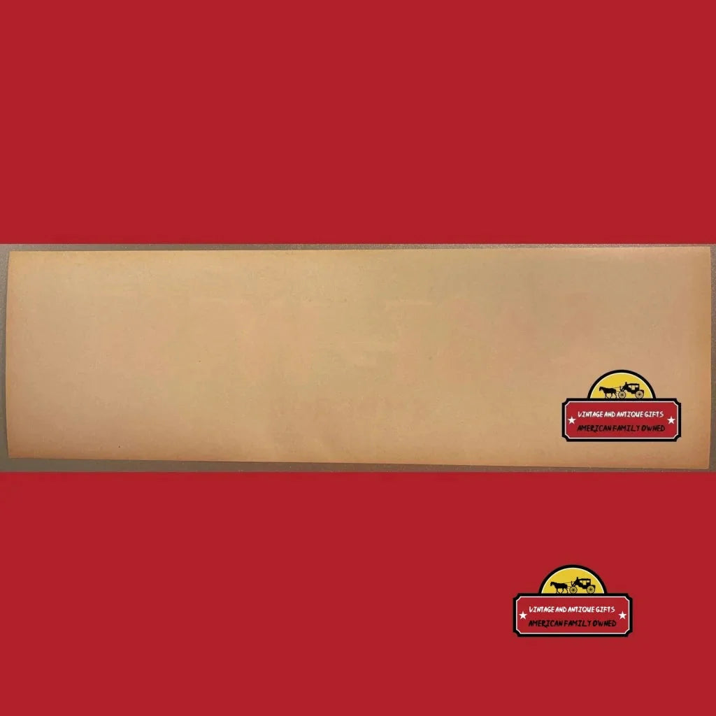 Wooden plank with a small sticker showcasing an Antique Vintage East West Crate Label