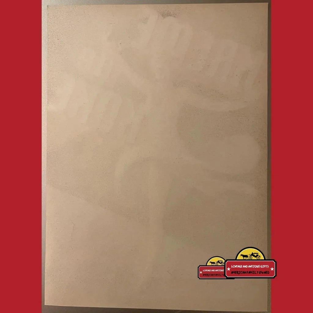 Blank beige paper featuring a cartoon burger sticker in a Rare 1930s Koke vegetable label