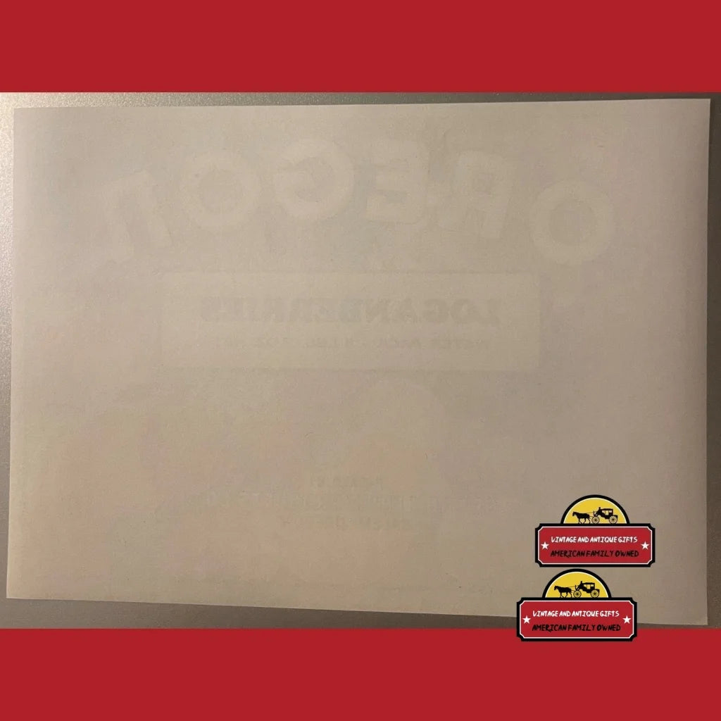 Envelope with red sticker faces showcasing Rare 1950s Loganberries Crate Label