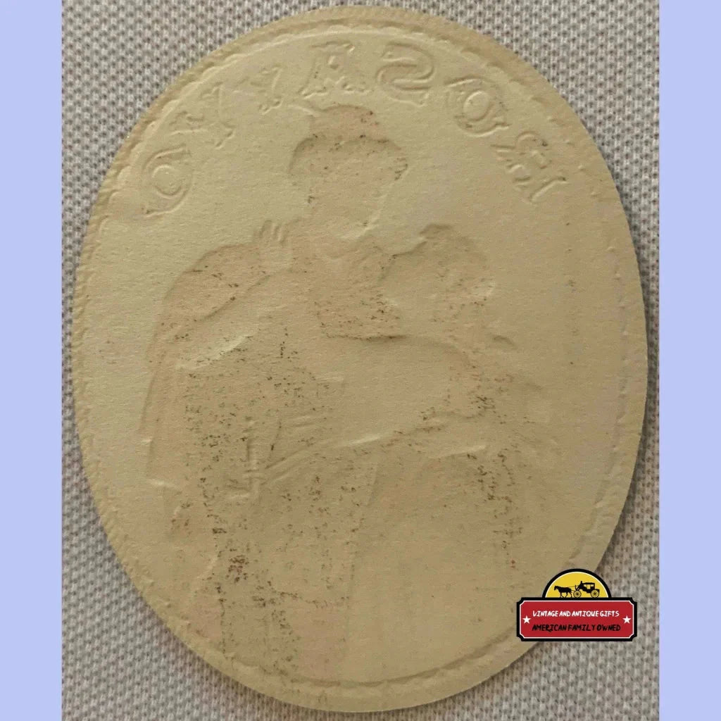 Oval-shaped clay relief sculpture of a seated figure on Rare Antique Vintage Rosayyo Embossed Cigar Label