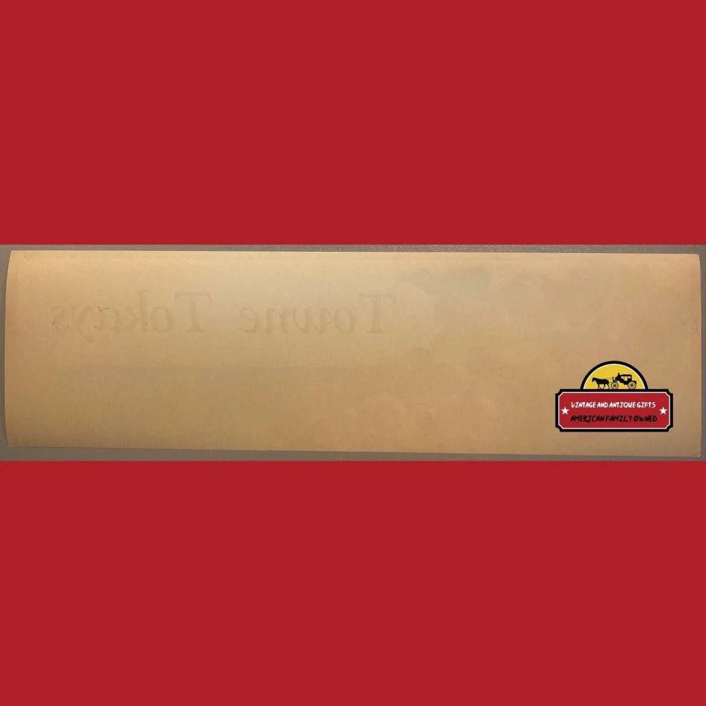 Wooden skateboard deck with small logo sticker near end, perfect for Antique Vintage Towne fans